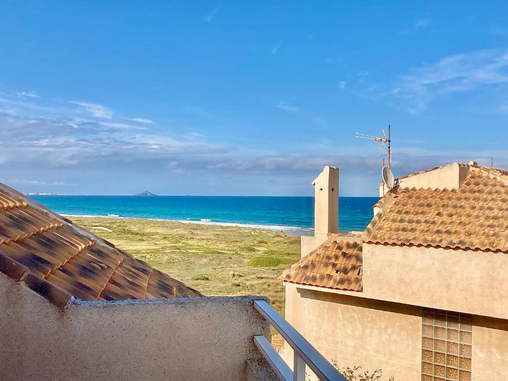 a view of the ocean from the roofs of two buildings at Spanish Connection - Las Amoladeras in Cabo de Palos