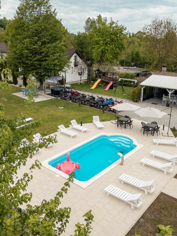 an overhead view of a pool with chairs and a playground at Casa Diana Confort in Avrig