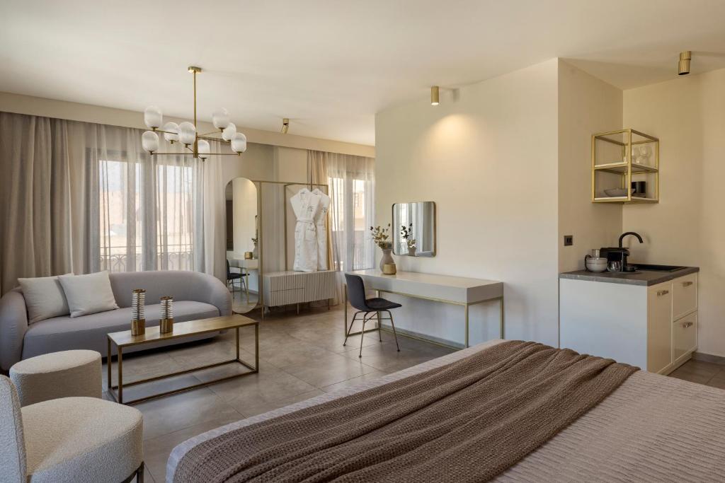 a room with a bed and a living room at PERATZADA central suite in Argostoli