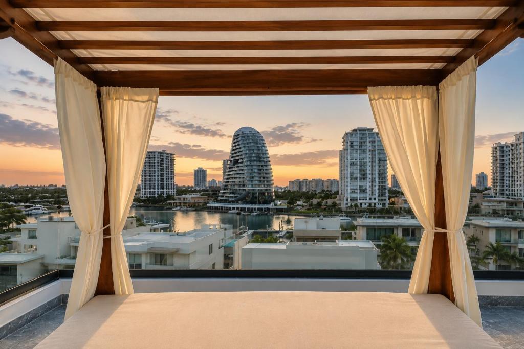 a bedroom with a view of the city at Luxury Retreat in Puerto Cancun with Rooftop Pool in Cancún