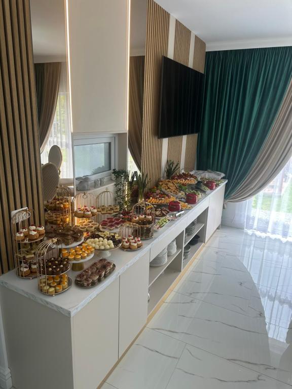 a buffet line with many different types of food at Casa DAIANA in Moisei