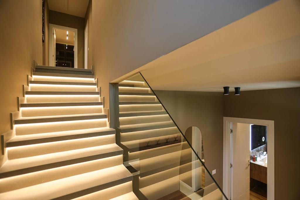 a staircase in a house with lights on it at Blue Coast - Villa 1 Perla Resort in Lalëz