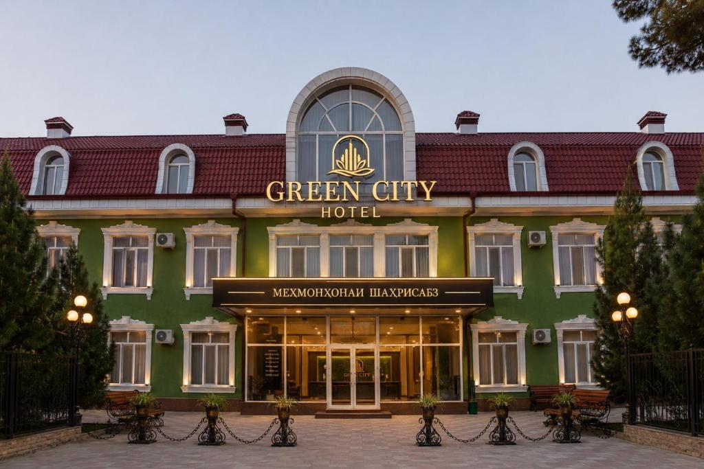 a green city hotel with a sign on it at Green City Hotel ШАХРИСАБЗ in Khujand