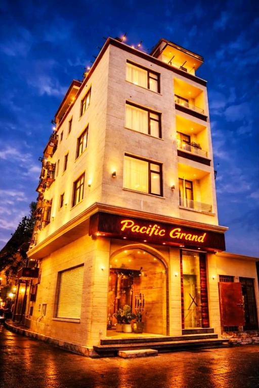 a large building with a pacific group sign on it at Pacific Grand in Amritsar