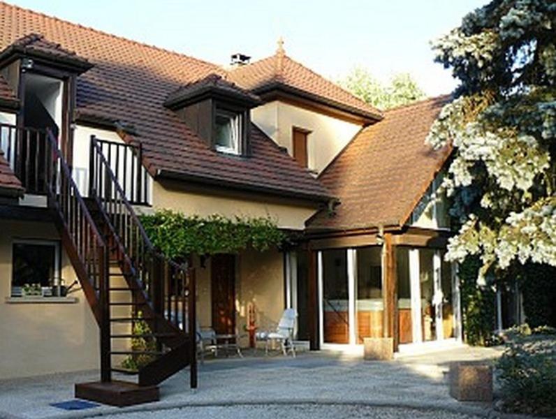 a house with a staircase in front of it at Chambres d'Hôtes Au Bout du Champ in Bavilliers