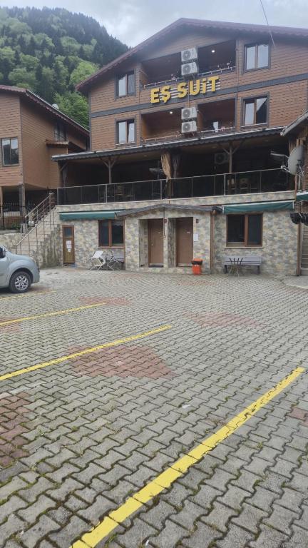 a parking lot in front of a building at EŞ Pansiyon in Uzungöl