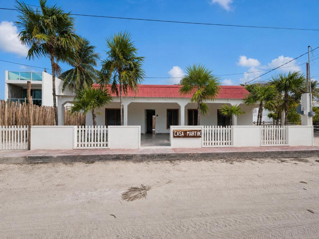 a white building with a sign that reads just married at Casa Martine in El Cuyo