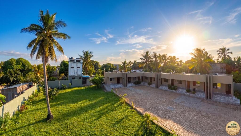 an aerial view of a house with a palm tree at Nhacuene's place in Vilanculos