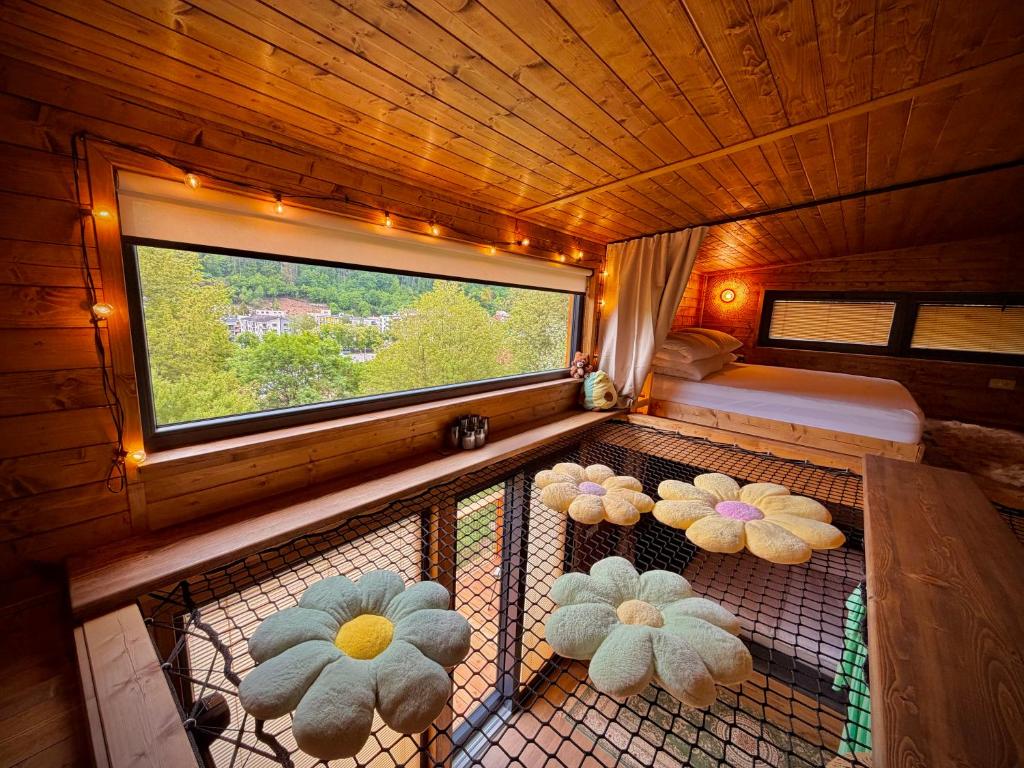 a room with four teddy bears in a cage at Sunny Garden House in Martinske Hole