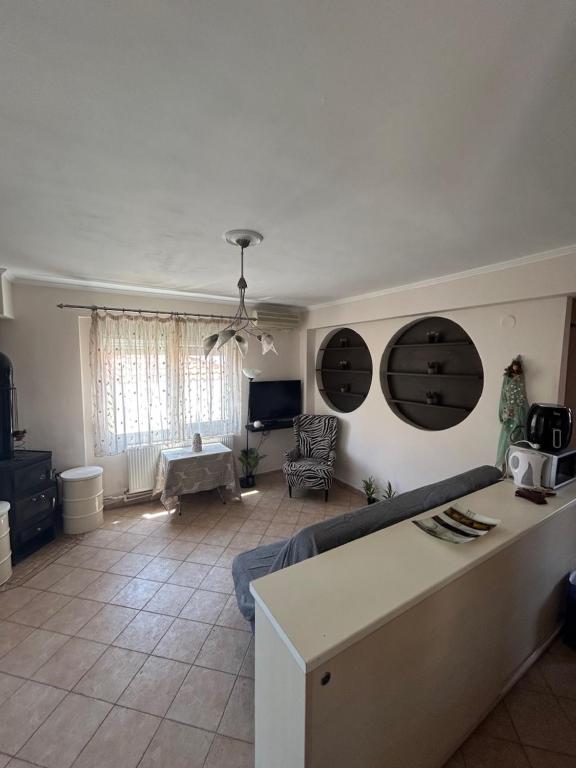 a living room with a couch and a table at Danai Nefeli Apartment in Siviri