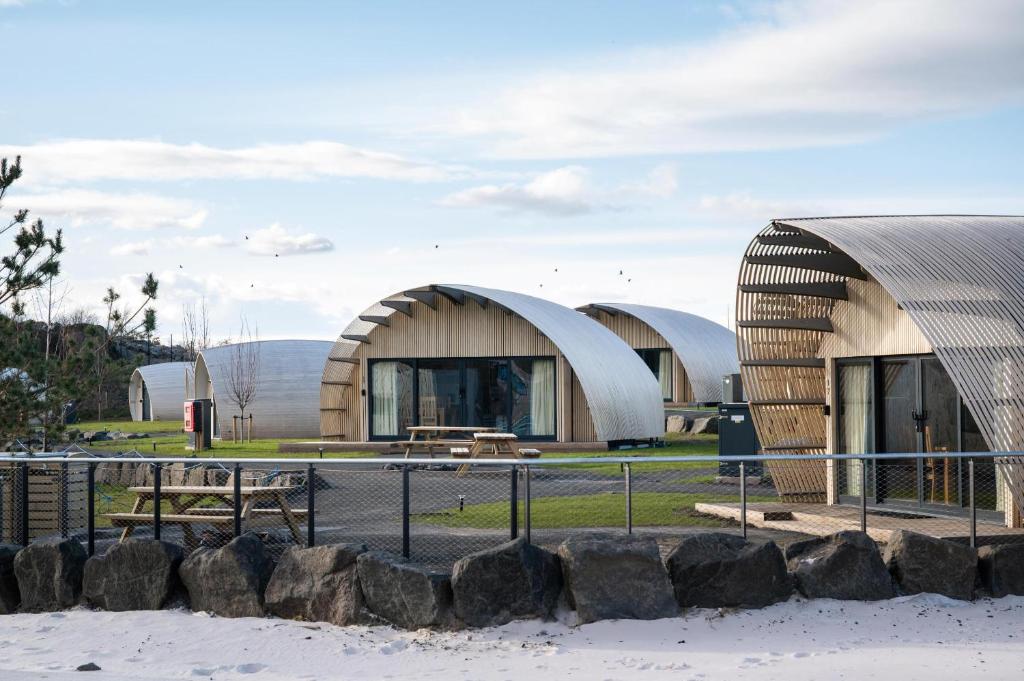 a group of domed buildings in a park at Lost Shore Surf Resort in Ratho