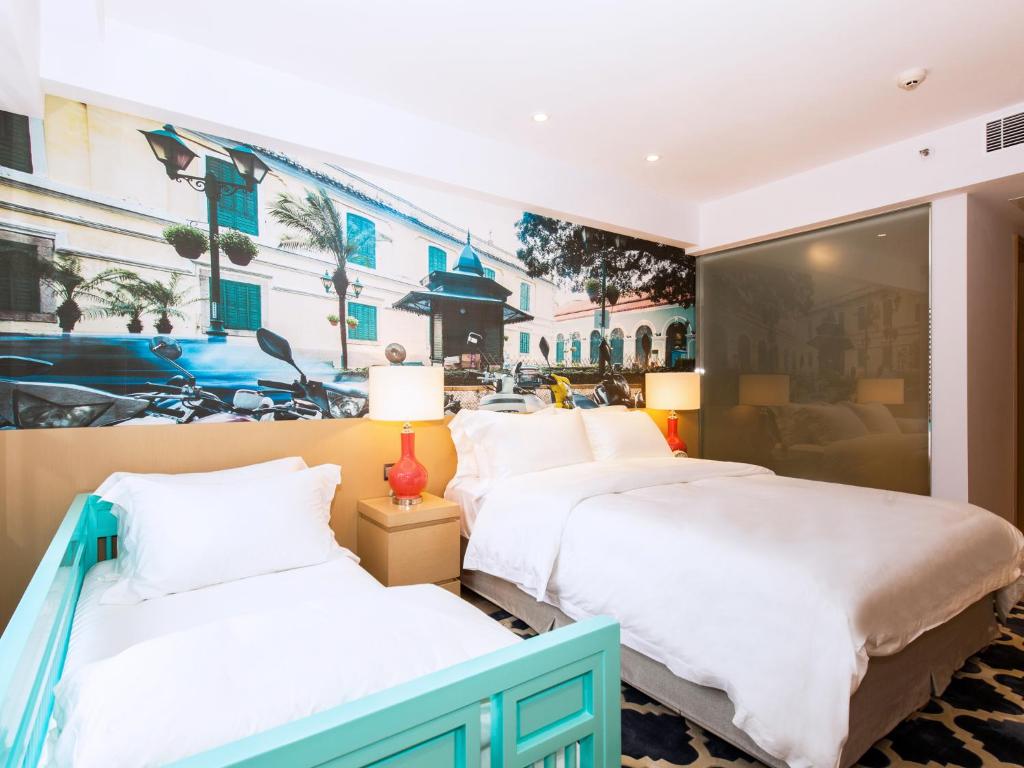 Voodi või voodid majutusasutuse Caravel Hotel toas