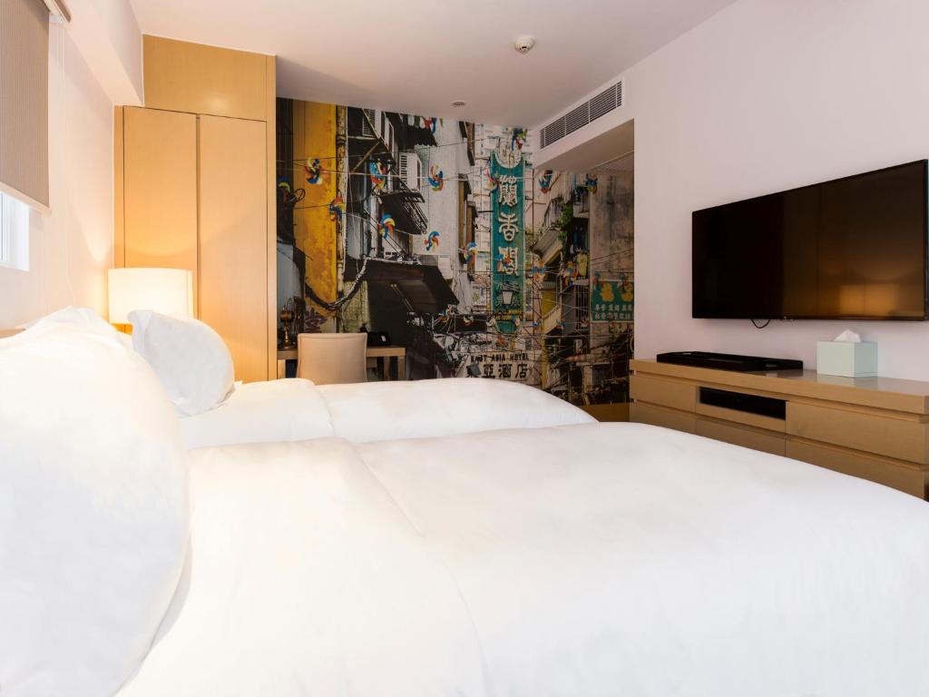 Voodi või voodid majutusasutuse Caravel Hotel toas