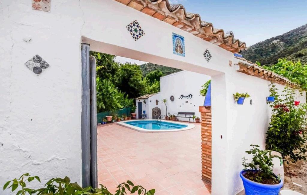 an external entrance to a house with a swimming pool at Casa La Seguiriya in Las Lagunillas