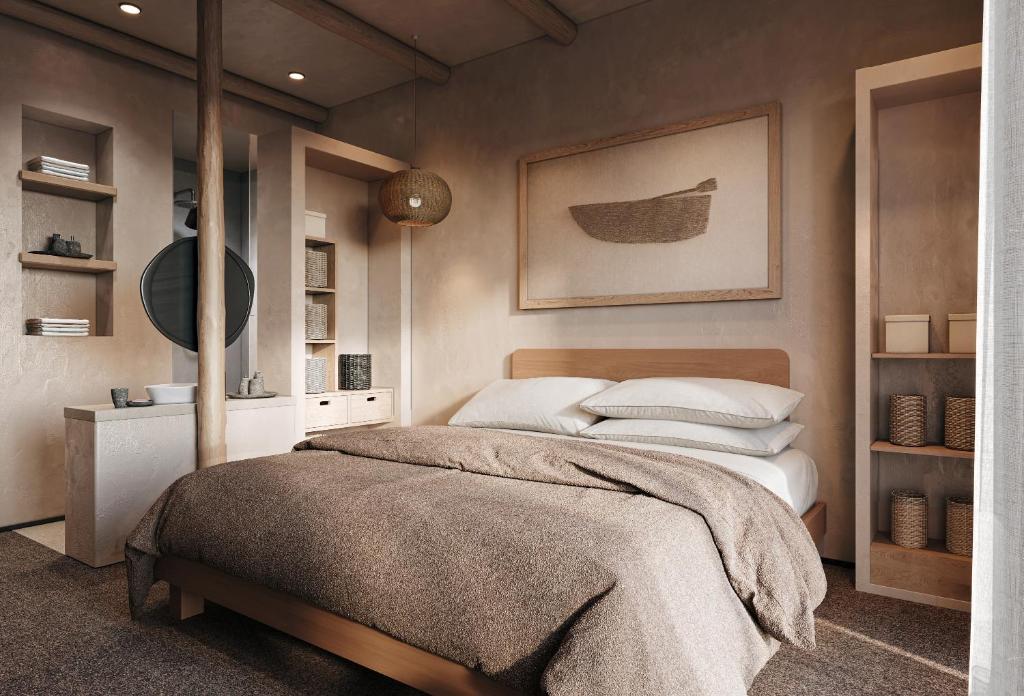 a bedroom with a bed and a wall with a picture at Nordic Vida Hotel in Cuxhaven