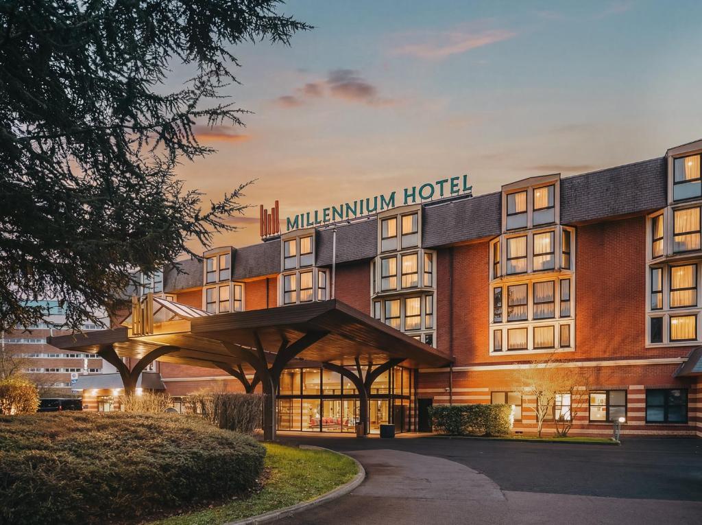 a rendering of the millenium hotel at dusk at Millennium Hotel Paris Charles De Gaulle in Roissy-en-France