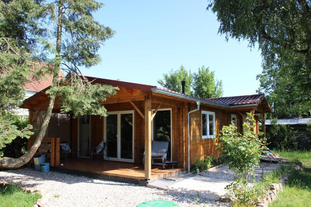 a cabin in the woods with a porch at Chalet Lohr in Lohr