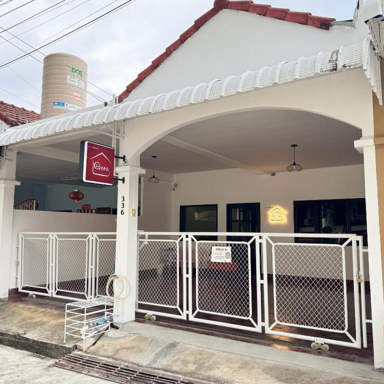 an entrance to a gas station with a gate at CHANN Guesthouse in Betong
