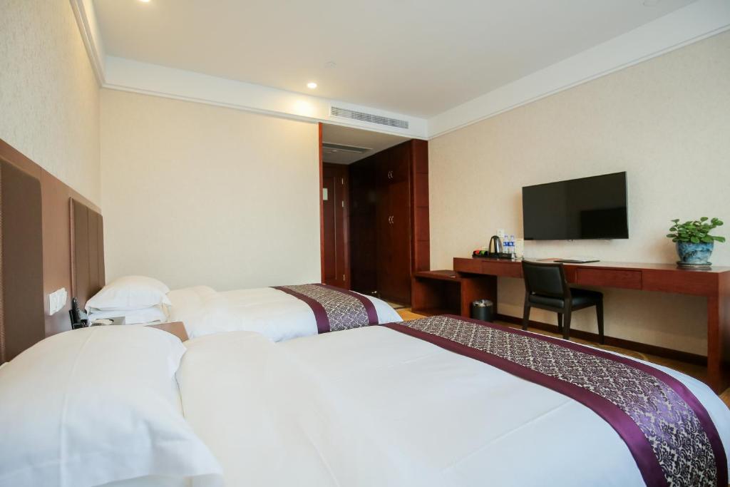 Postel nebo postele na pokoji v ubytování New Knight Royal Hotel Airport and International Resort