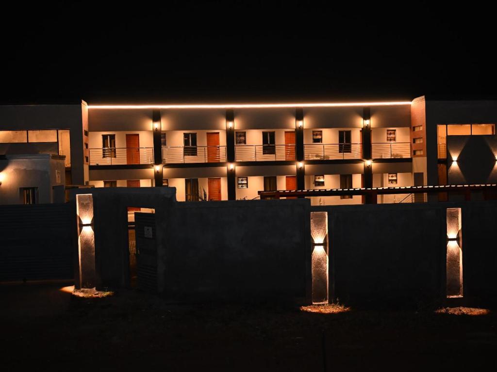 a building with lights in front of it at night at Gae Ga Monare Guest House in Burgersfort