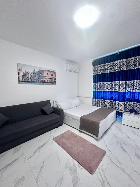 a living room with a bed and a couch at Venice Night 11 in Mestre