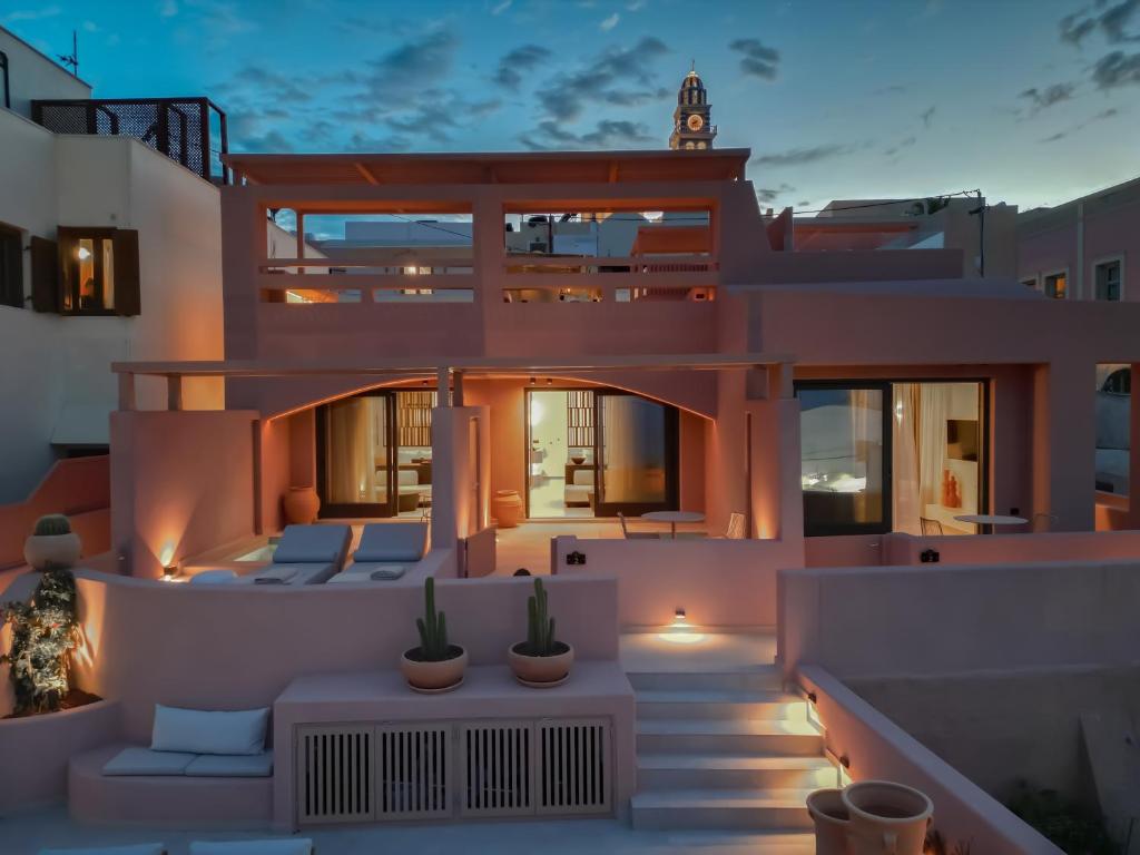 a view of a house at night at Thianne Luxury Suites in Fira