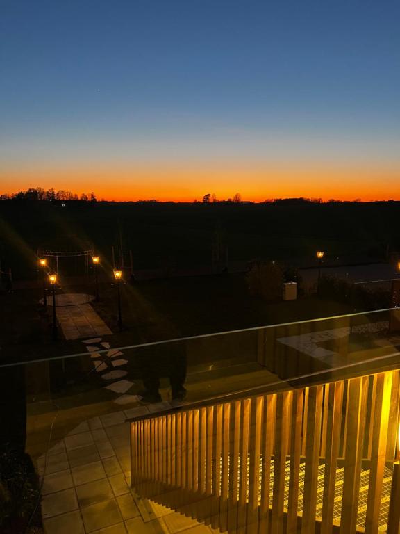 a cat standing on a balcony at sunset at Ludvigsdals Gård in Ystad