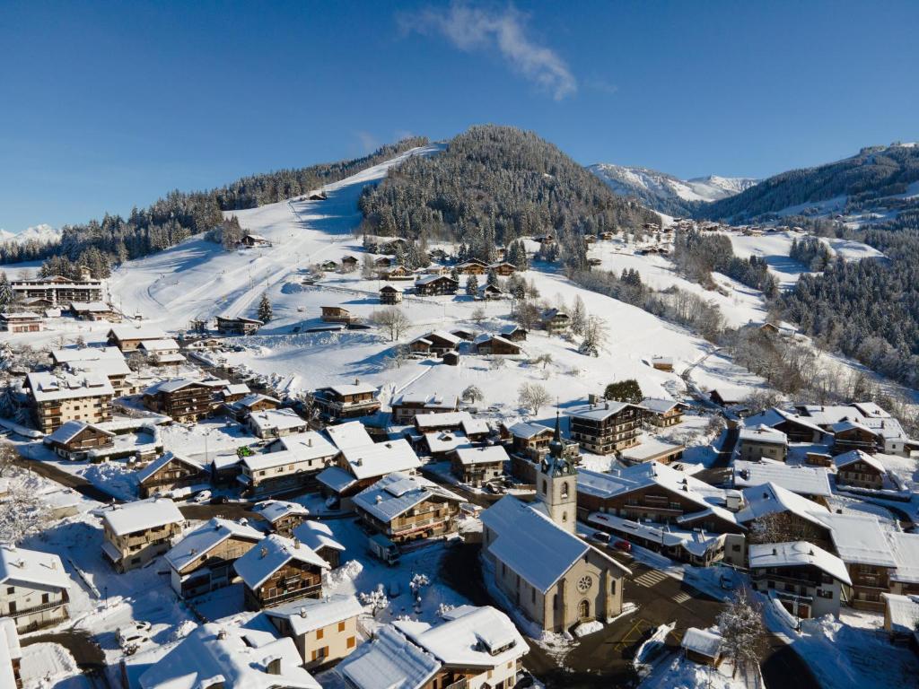 an aerial view of a village covered in snow at TERRESENS - Les Balcons de Juliette in Notre-Dame-de-Bellecombe