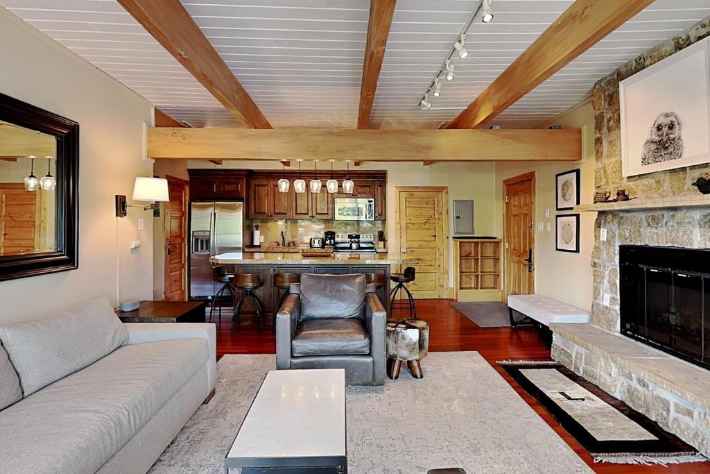 a living room with a couch and a fireplace at Timberline Condominiums 2 Bedroom Deluxe Unit D2D in Snowmass Village