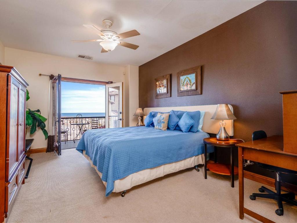 a bedroom with a blue bed and a window at Condo 40-4 El Dorado Ranch in San Felipe