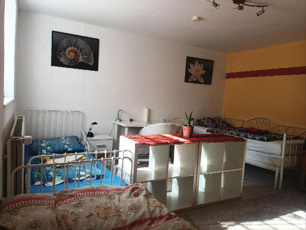 a room with two bunk beds and a room with two beds at Ruhige Ortsrandlage 1 in Kiel