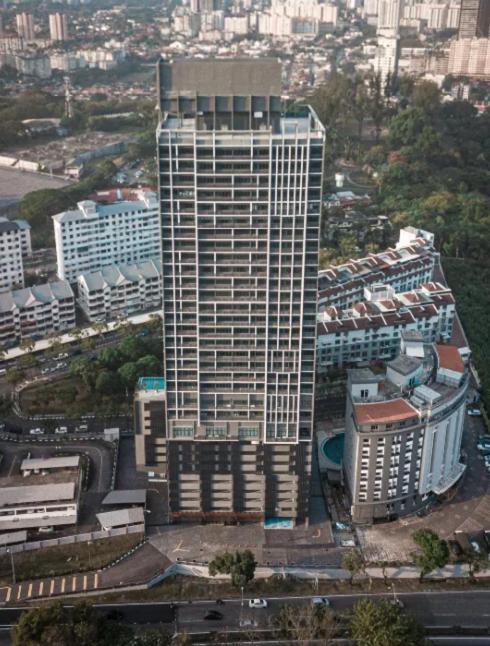 an aerial view of a tall building in a city at VOS Suites By BOLD in Gelugor