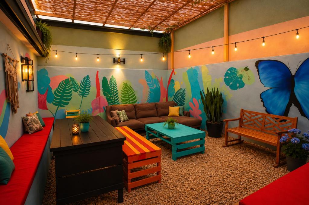 a living room with a couch and a table at Chillout Hostel Barrio Escalante in San José