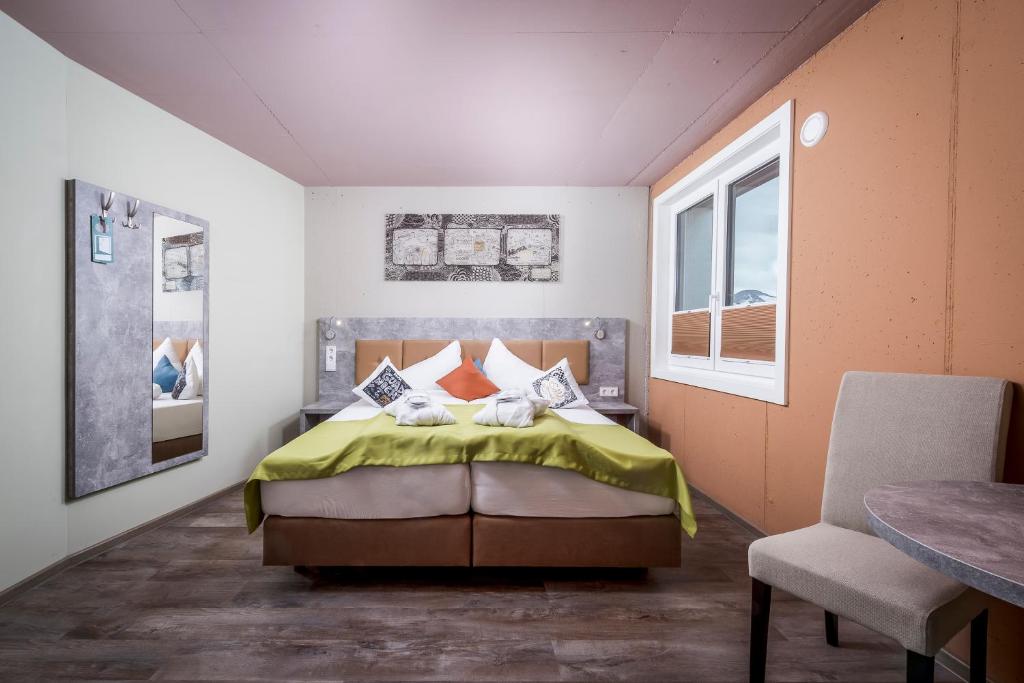 Posteľ alebo postele v izbe v ubytovaní Cubo Sport & Art Hotel