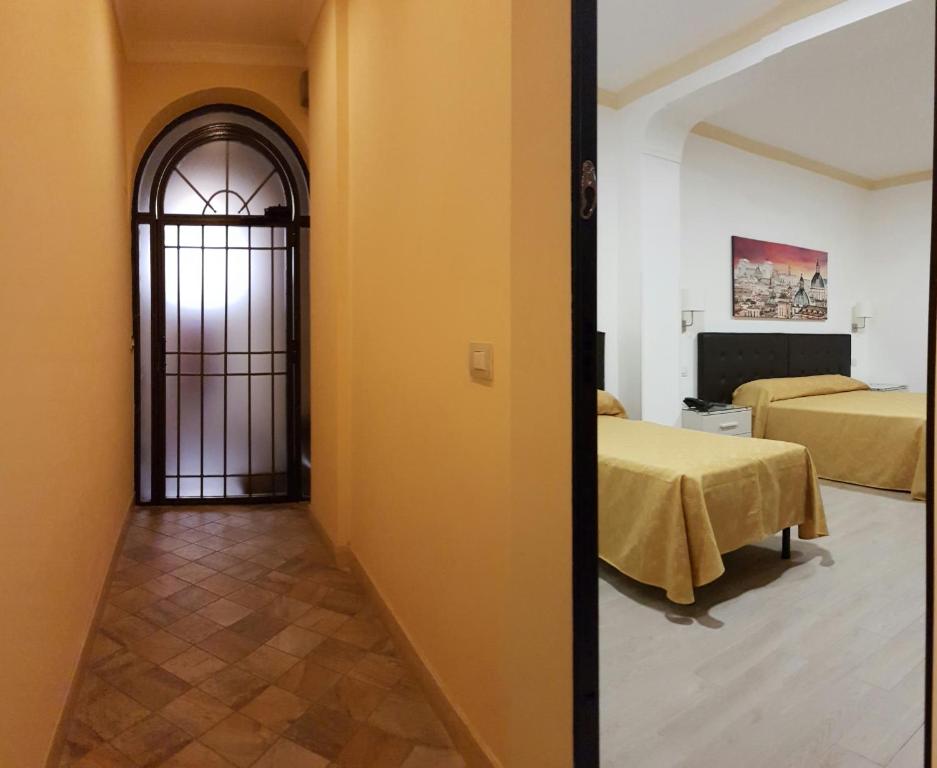 Postel nebo postele na pokoji v ubytování Hotel Artorius