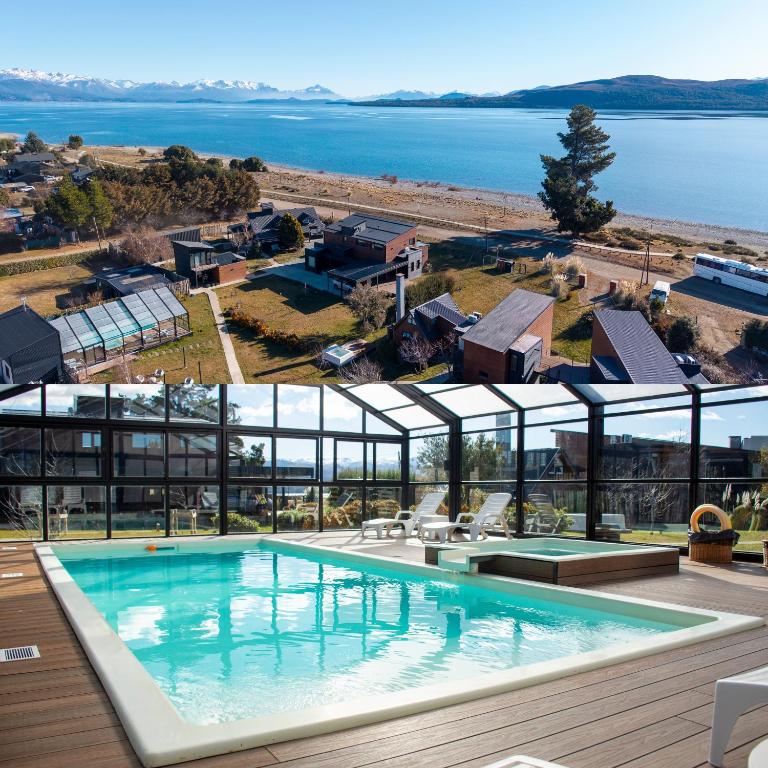 a large swimming pool in front of a building at Luna Llena Dina Huapi in Dina Huapi