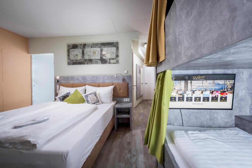 Posteľ alebo postele v izbe v ubytovaní Cubo Sport & Art Hotel