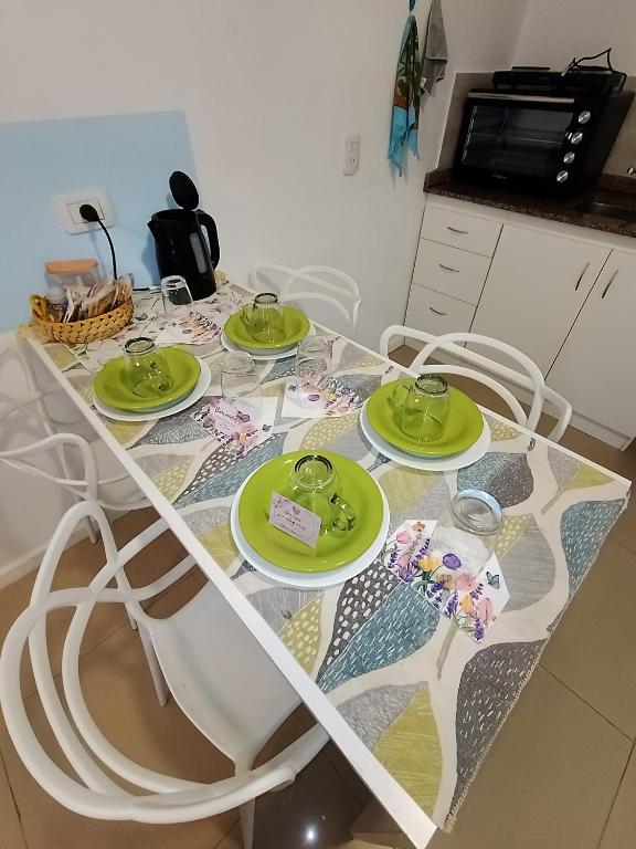 a table with four green plates on it at SAN jose in Federación