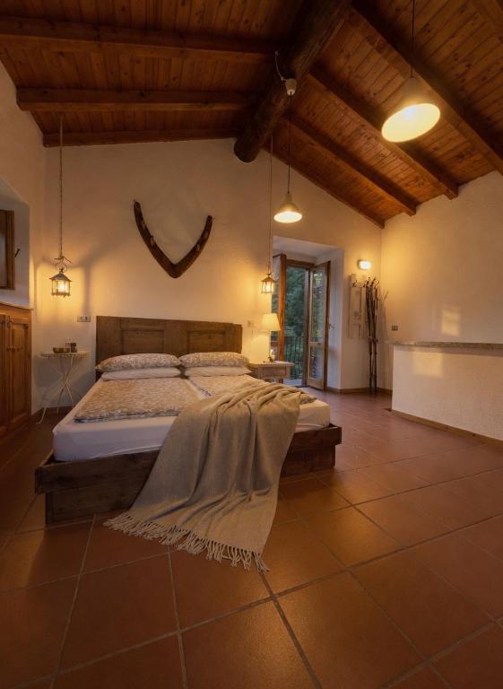 a bedroom with a large bed in a room at Casa Antonietta in Domaso