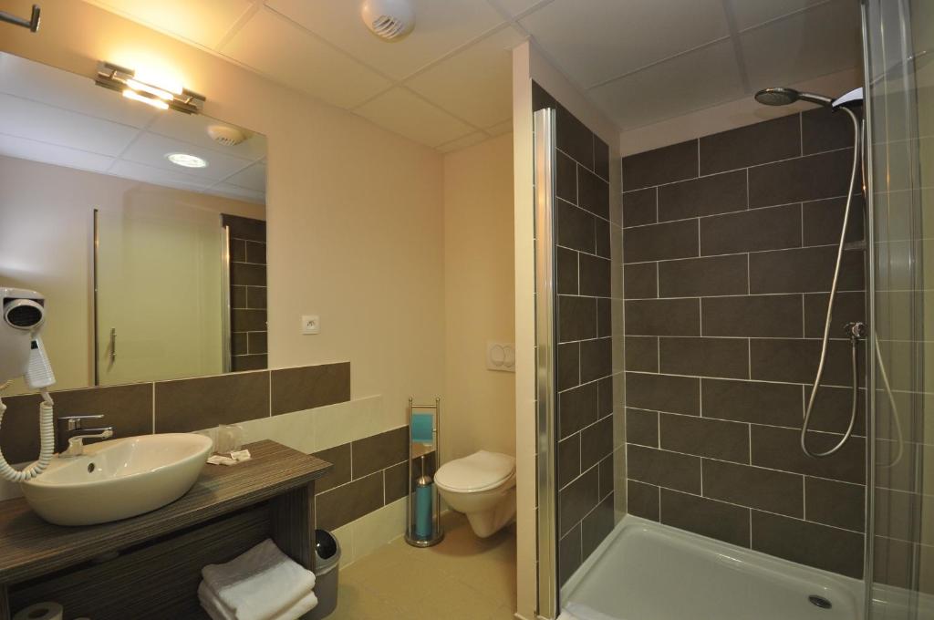 Koupelna v ubytování Hotel Caiman