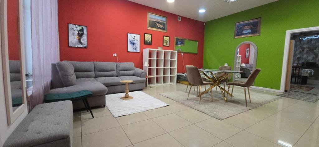 a living room with a couch and a table at Residence APOLLO MJ z dwoma pokojami in Ząbkowice Śląskie