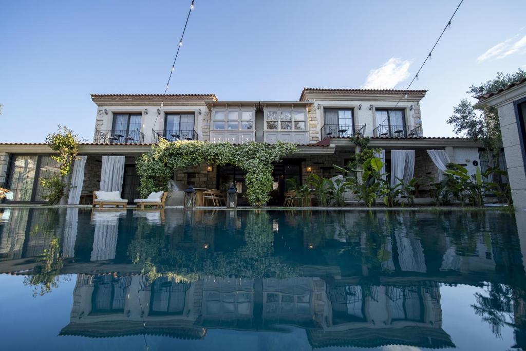a house with a pool in front of it at Moranka by ALS ALAÇATI in Alaçatı