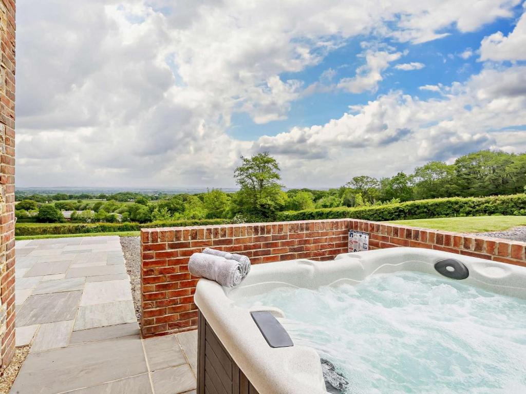 an outdoor jacuzzi tub in a brick wall at 4 Bed in Chard oc-83501 in Combe Saint Nicholas