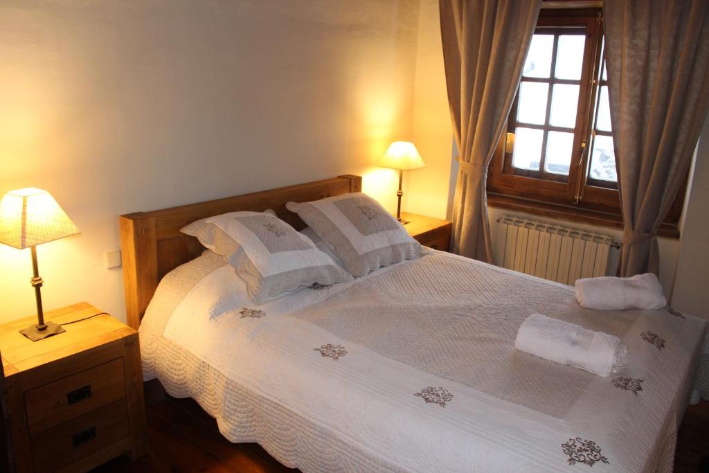Postel nebo postele na pokoji v ubytování Ski Andorra Tarter Chalet Lodge