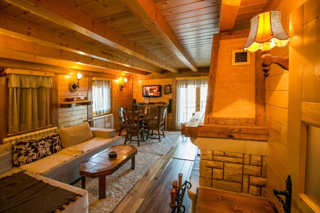 a living room with a couch and a table at Vila Dizdarevic Kopaonik in Kopaonik