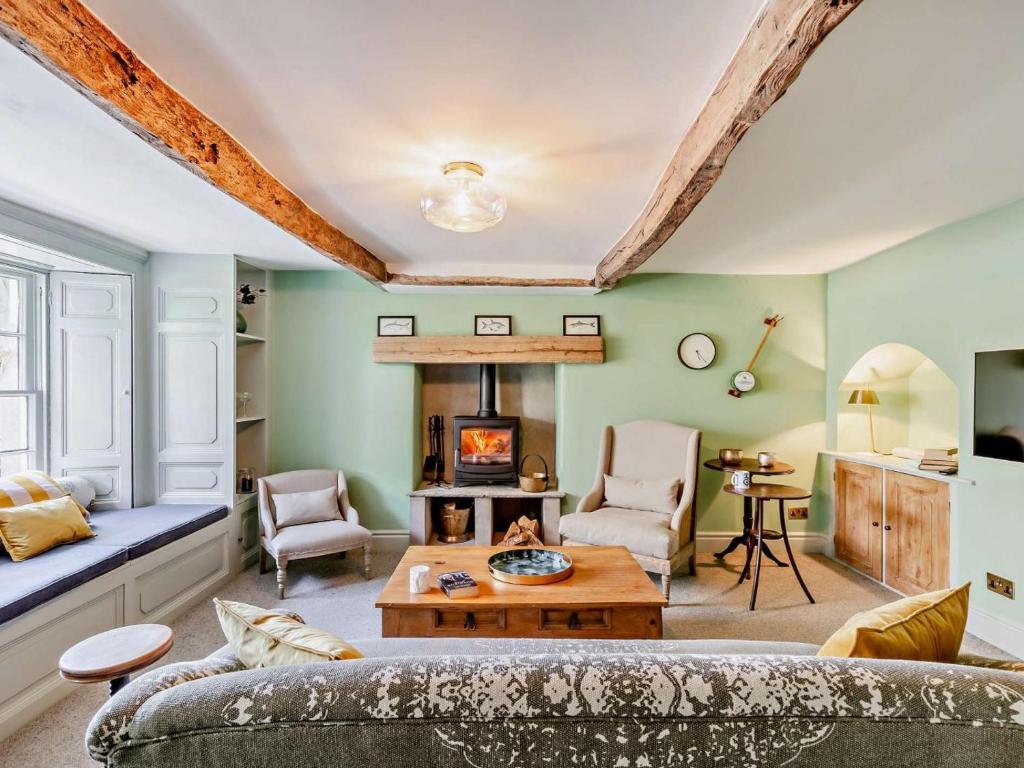 a living room with a couch and a fireplace at 3 Bed in Settle oc-92466 in Settle