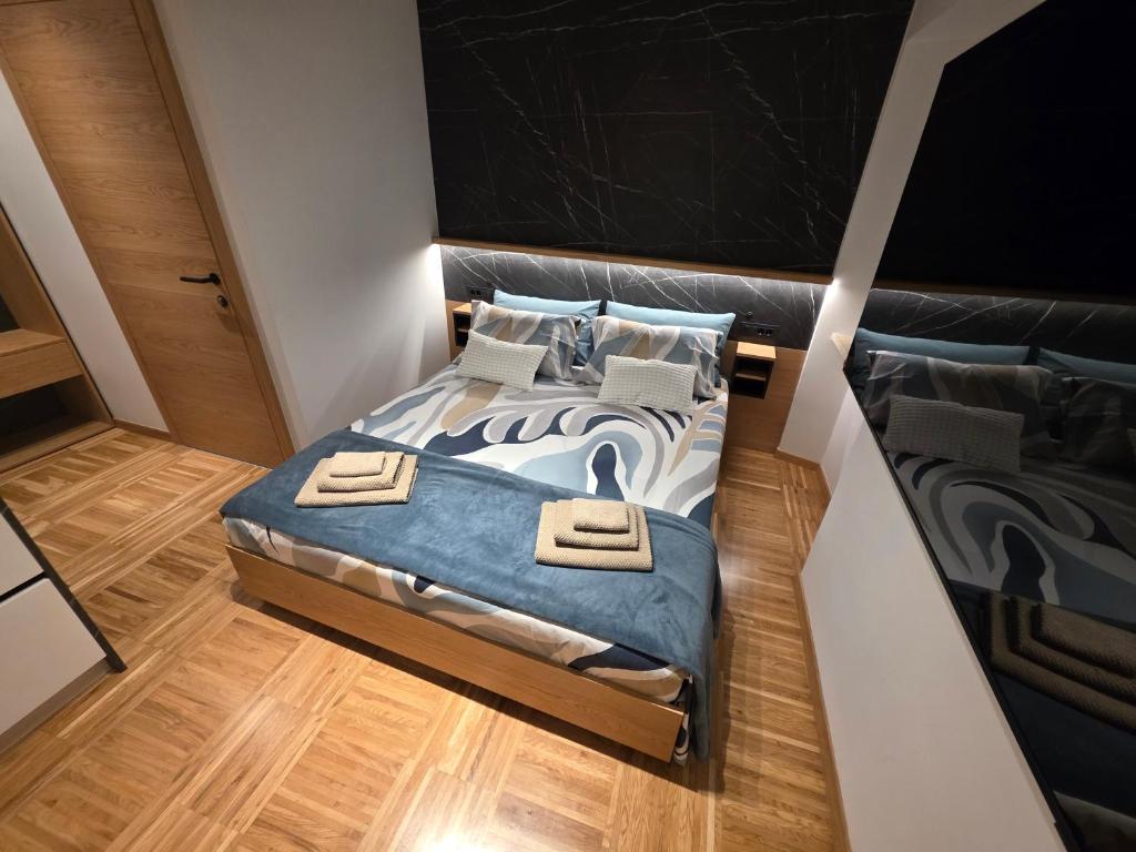 a bedroom with a bed with two towels on it at Apartmaji Sonce in Piran
