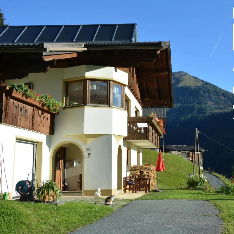 a house with solar panels on the side of it at Ferienhaus Ströbl in Liesing