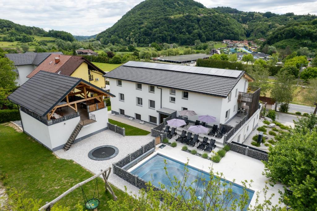 an aerial view of a house with a swimming pool at VILA LISJAK - Apartments in Podčetrtek