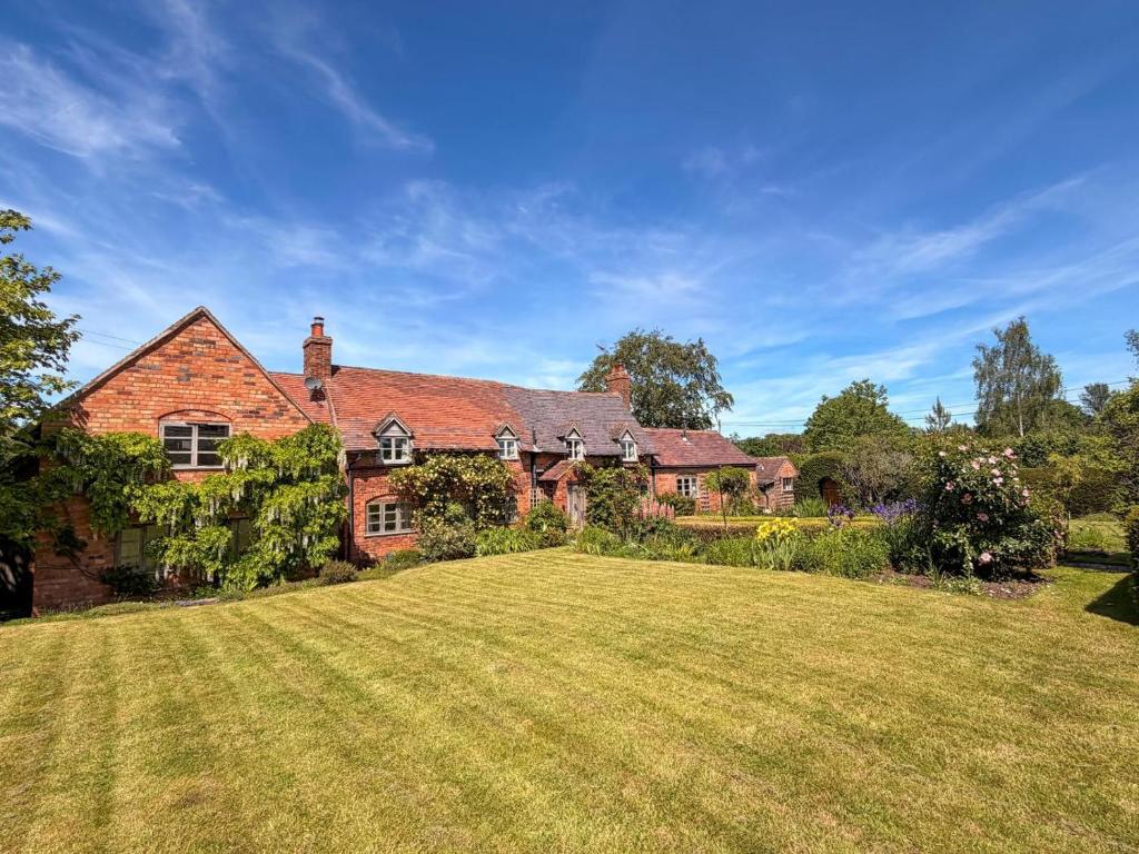 a large brick house with a large grass yard at 4 Bed in Shrawley oc-s34861 in Shrawley